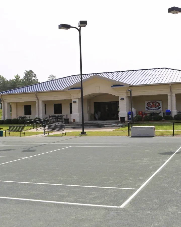 Clay courts and the clubhouse at the Yarbrough Tennis Center